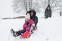 Jane Gill sledging with her four-year-old granddaughter Rosie. Picture: Margesson Photography