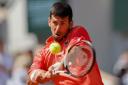 Novak Djokovic eased into the second round of the French Open (Jean-Francois Badias/AP)