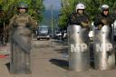 KFOR soldiers and Kosovo police guard a municipal building (Dejan Simicevic/AP)