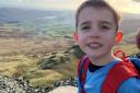 Oscar Burrow, six, who has summited 12 of the highest mountains in the UK to raise funds for Derian House Children’s Hospice (Matt Burrow/PA)