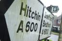 Signs for Hitchin, Shefford and Bedford near the Hertfordshire and Bedfordshire boundary.
