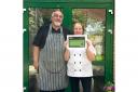 Birute and Petru at Southwell Court with their food hygiene certificate