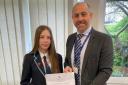 Lily Haines receives her award from Matt Roberts, who is Head of School at Barnwell.