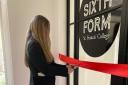Head girl Ella cuts the ribbon for the new Sixth Form Centre at St Francis' College