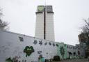 The Grenfell Memorial Wall sits beneath the tower.