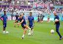 England's Harry Kane warms up ahead of the FIFA World Cup Group B match at the Khalifa International Stadium, Doha.