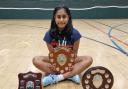 Saghana Thayaparan with her three county trophies. Picture: THEEPA THAYAPARAN