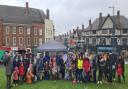 People braved the rain to gather on Windmill Hill for the kite-flying event in Hitchin.