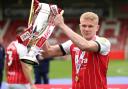Lewis Freestone with the League Two trophy in 2021. Picture: BRADLEY COLLYER/PA