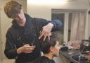 Nathan shows off his barbering skills