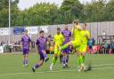 Hitchin Town skipper Liam Brooks has a go at Barwell. Picture: PETER ELSE