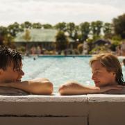 Harry Styles and Emma Corrin star in My Policeman. Here they are pictured in Hitchin's outdoor pool.