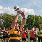 Letchworth skipper Alex Amos lifts the Herts Presidents' Cup.