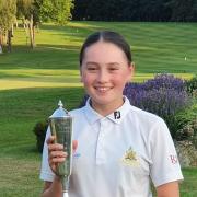 Tala Clarke with her trophy for winning the English Schools Golf Association U16 Championship.