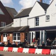 Temporary seating area outside Cinnabar in Stevenage High Street, in place of parking bays