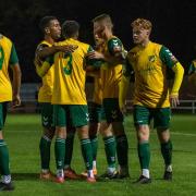 Hitchin Town celebrate their equaliser against St Ives Town.