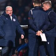 Steve Evans and his assistants discuss tactics in Stevenage's win over Hartlepool United.