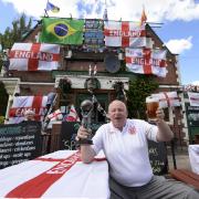 Landlord Norman Scott outside the Robin Hood pub in Jarrow ahead of the 2014 World Cup. Picture: OWEN HUMPHREYS/PA