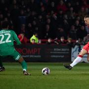Luke Norris slides in Stevenage's third in the win over Leyton Orient. Picture: DAVID LOVEDAY/TGS PHOTO