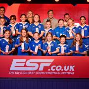 Hitchin Belles U12 Blues receive their medals from Glenn Hoddle and Faye White. Picture: ESF EVENT PHOTOGRAPHY