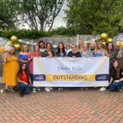 Staff at Glebe Kids nursery in Letchworth celebrate after being rated outstanding by Ofsted.