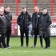 Referee Sam Purkiss (second from right) explains his decision to Steve Evans. Picture: TGS PHOTO