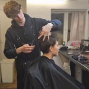 Nathan shows off his barbering skills