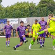 Hitchin Town skipper Liam Brooks has a go at Barwell. Picture: PETER ELSE