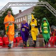 The team from Best Before Café run as vegetables.