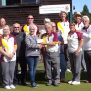 Letchworth Garden City Bowls Club present a cheque to the Jackie's Drop-in charity. Picture: LGCBC