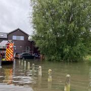 Woolgrove Road in Hitchin is flooded.