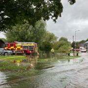 Firefighters have been pumping water away from homes in Hitchin's Woolgrove Road.