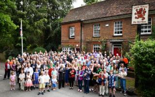 People celebrating the 40th anniversary of The Red Lion becoming a community-owned pub last year.