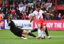 Elliott List is tackled by Adam Jackson as Stevenage took on Lincoln City. Picture: TGS PHOTO