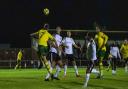 George Morrall heads in a goal for Hitchin Town against Bishop's Stortford. Picture: PETER ELSE