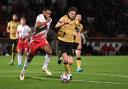 Stevenage's Nathan Thompson and Paul Mullin of Wrexham battle for the ball. Picture: TGS PHOTO