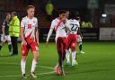 Stevenage's Harvey White and Jamie Reid walk off the pitch after the defeat at home to Bolton. Picture: TGS PHOTO