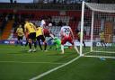 Jamie Reid puts Stevenage into the lead against Guiseley in the FA Cup. Picture: TGS PHOTO