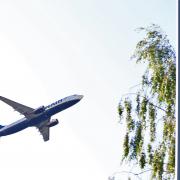 A Ryanair flight departs from Luton Airport on the Bedfordshire and Hertfordshire border.