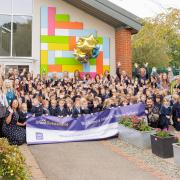 Staff and pupils at Woolenwick Infant and Nursery School celebrate their 'outstanding' Ofsted rating.