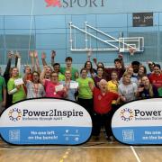 The Power House Games in Cambridge, including Willmott Dixon's Natalie Sidey (left, pink shirt) and Power2Inspire founder and chief ambassador John Willis (centre, red shirt)