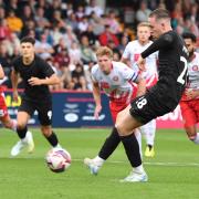 Jack Moylan scores the winning goal for Lincoln from the penalty spot at Stevenage. Picture: TGS PHOTO