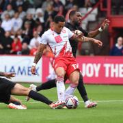 Elliott List is tackled by Adam Jackson as Stevenage took on Lincoln City. Picture: TGS PHOTO