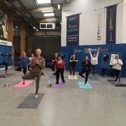 Engineering and Construction staff taking part in a yoga session