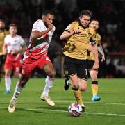 Stevenage's Nathan Thompson and Paul Mullin of Wrexham battle for the ball. Picture: TGS PHOTO