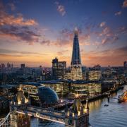 Tower Bridge and the skyline of London, just after sunset