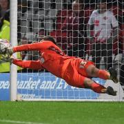 Murphy Cooper saves the final Guiseley penalty to send Stevenage through in FA Cup. Picture: TGS PHOTO