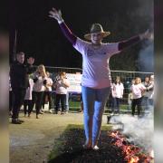 Participants walked over red-hot coals at Lister Hospital in Stevenage