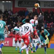 Reading goalkeeper Joel Pereira pinches a ball away from Carl Piergianni. Picture: TGS PHOTO