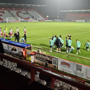 Tired bodies at half-time in extra-time between Stevenage and Cheltenham.